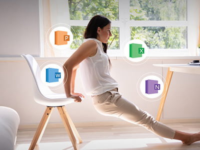 A person with dark hair, wearing a white sleeveless top and light-colored pants, is doing tricep dips using a white chair in what appears to be a home office. Their body is angled away from a desk with a computer monitor and laptop. Four circular icons with the Microsoft Office logos for PowerPoint, Excel, Word, and OneNote float around them. The room is brightly lit with natural light coming from a large window.